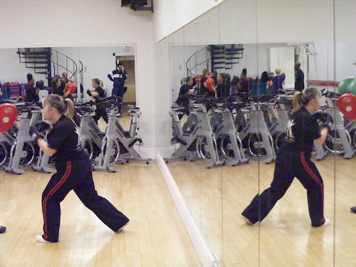 A reflection of a student practising at the Richmond Olympus GYM