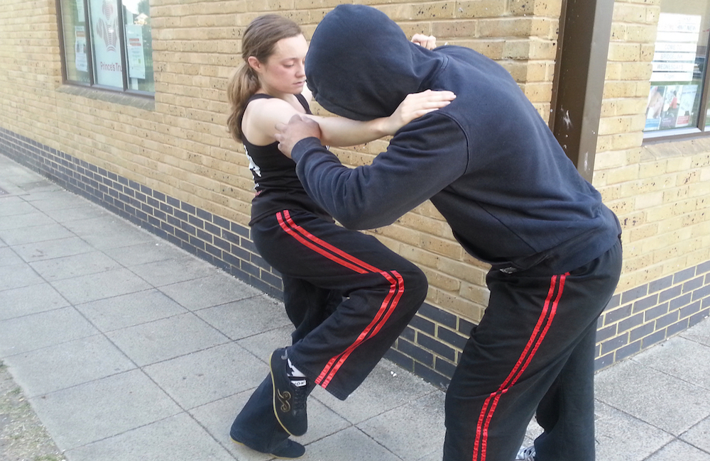 A Student performs street self defence technique on a would be assailant